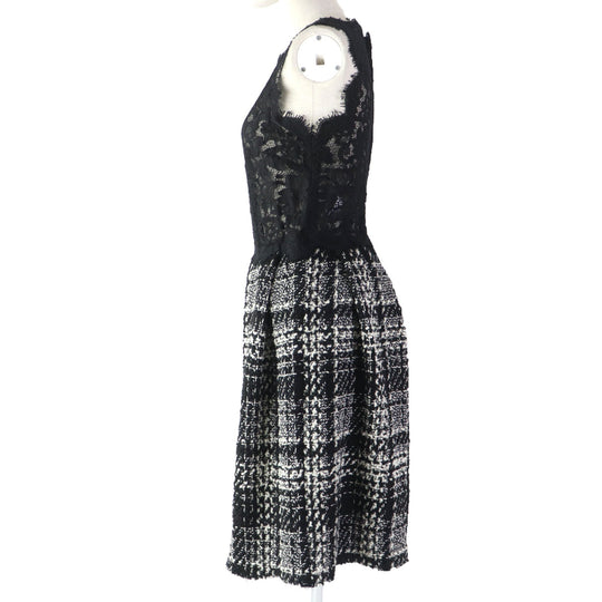DOLCE&GABBANA ensemble Main: 78% wool, Main: 18% nylon, Main: 3% mohair, Main: 3% alpaca, Lining: 96% silk, : 3% alpaca Lining: 100% polyester black Women (Top) 36, (Bottom) 38 Used Authentic