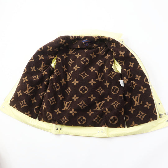 LOUIS VUITTON Down vest Outer: 100% cotton, Lining: 75% polyester, Lining: 25% acrylic, Filling: 90% down, Filling: 10% feather, Part: PVC Light yellow Women 34 Used Authentic