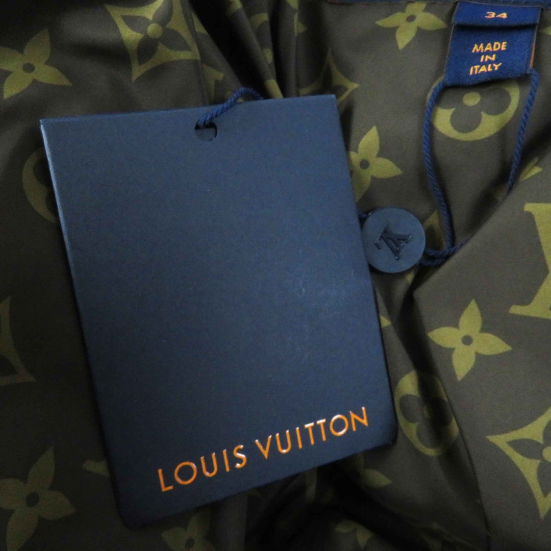 LOUIS VUITTON Down jacket Outer: 71% nylon, Outer: 29% polyester, Lining: 50% polyester, Lining: 50% cotton, Filling: 90% down, Belt: 100% cotton, Sheepskin blue Women 34 Used Authentic
