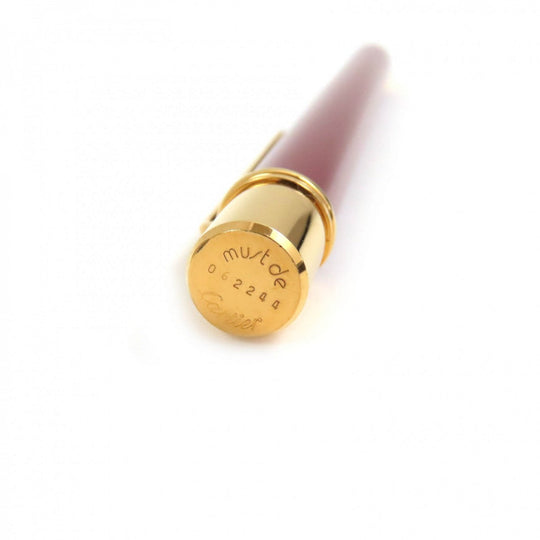 CARTIER Ballpoint pen ST150190 Steel lacquer, yellow cold plated details Bordeaux Gold Must de Cartier