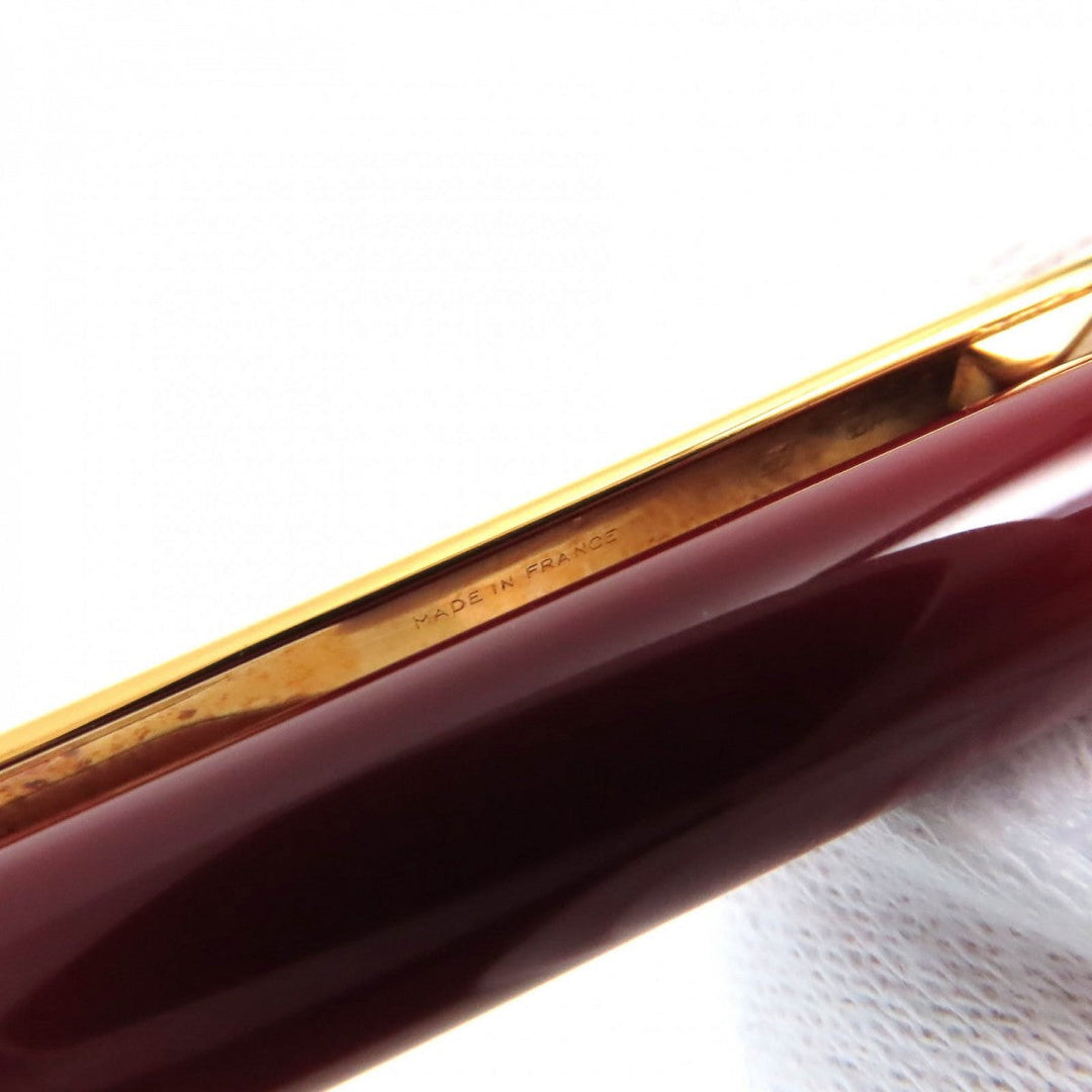 CARTIER Ballpoint pen ST150190 Steel lacquer, yellow cold plated details Bordeaux Gold Must de Cartier