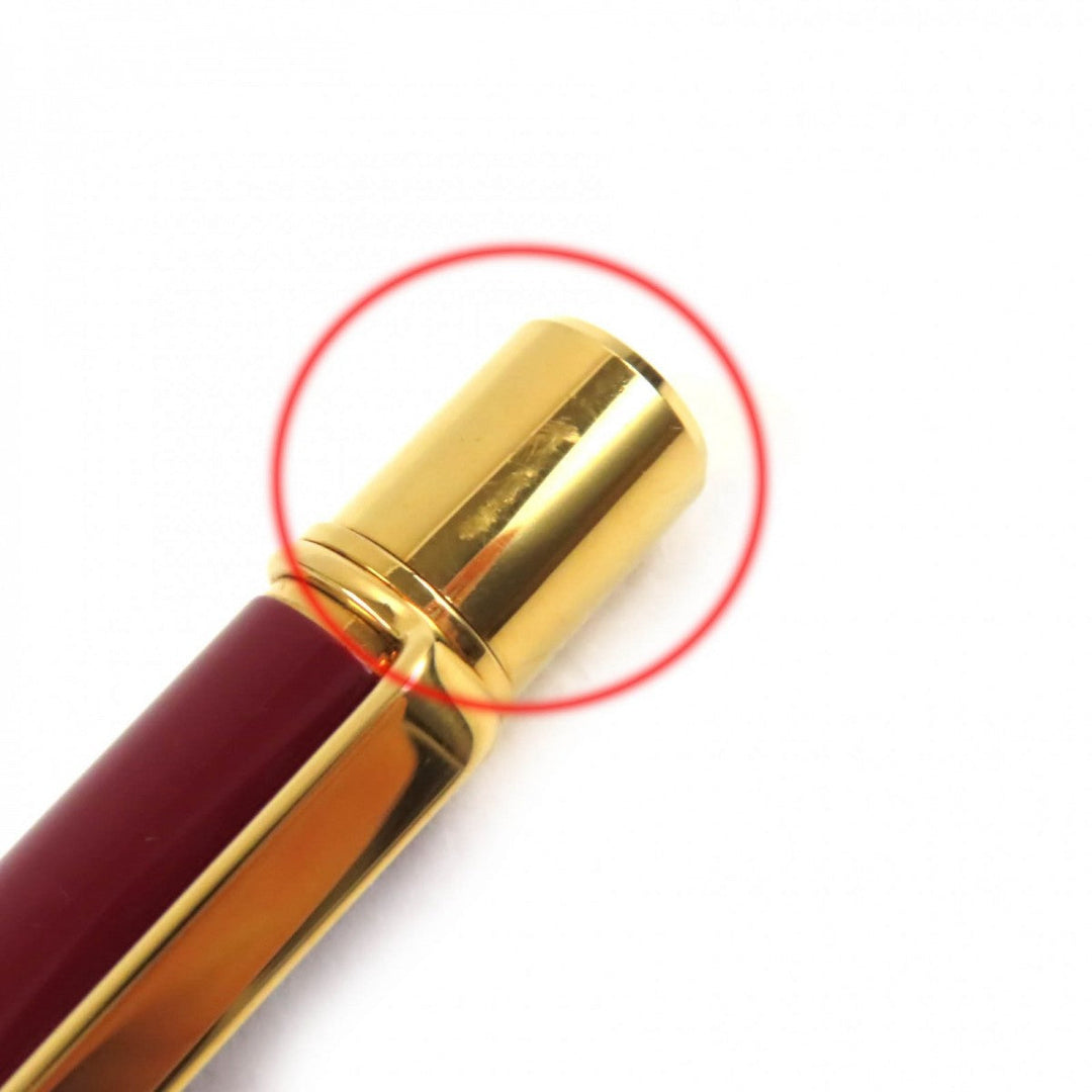 CARTIER Ballpoint pen ST150190 Steel lacquer, yellow cold plated details Bordeaux Gold Must de Cartier