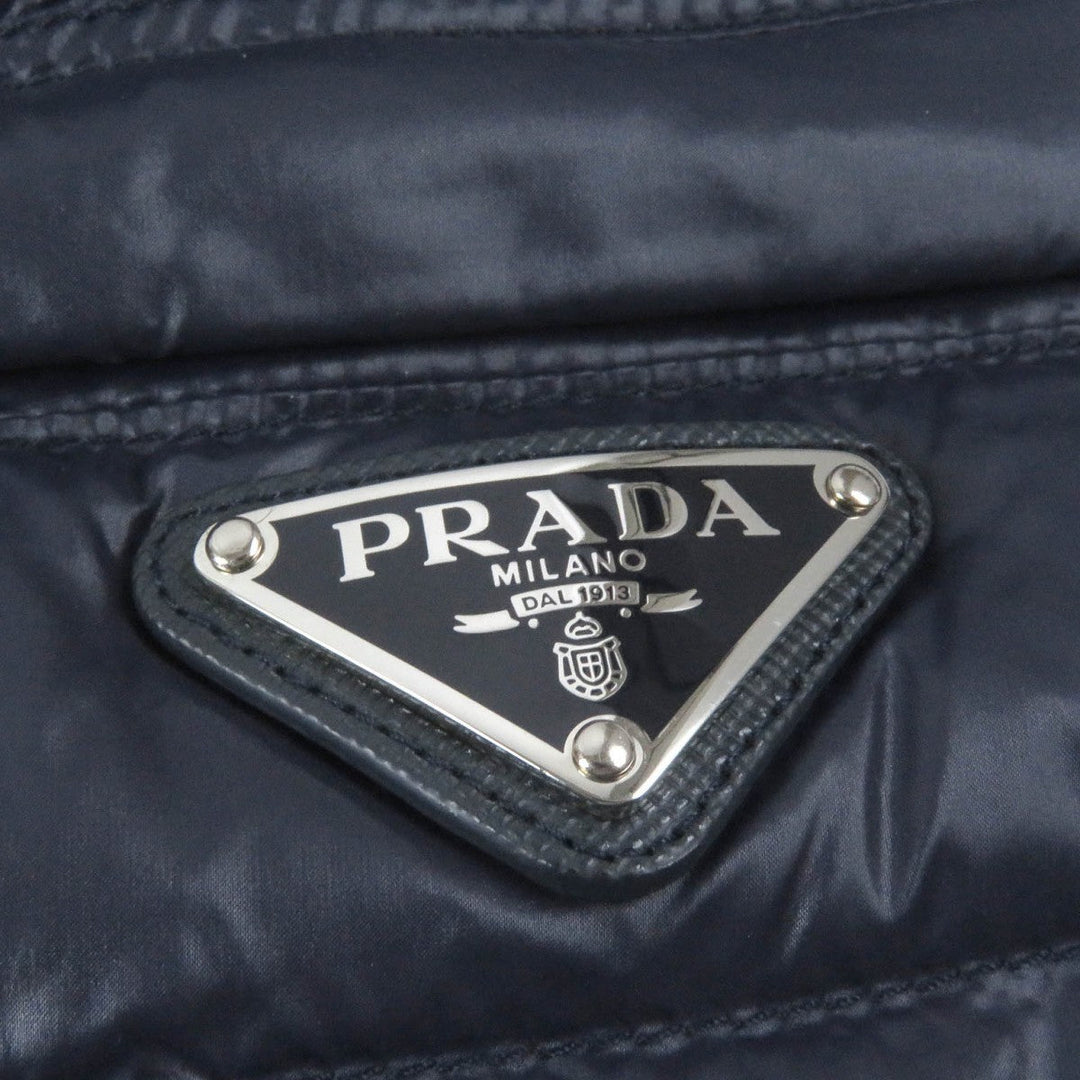PRADA Down jacket SGA506 Main: 100% polyamide (nylon), Filling: 90% down, Filling: 10% feather, Partially recycled polyester Navy mens 46 Used Authentic