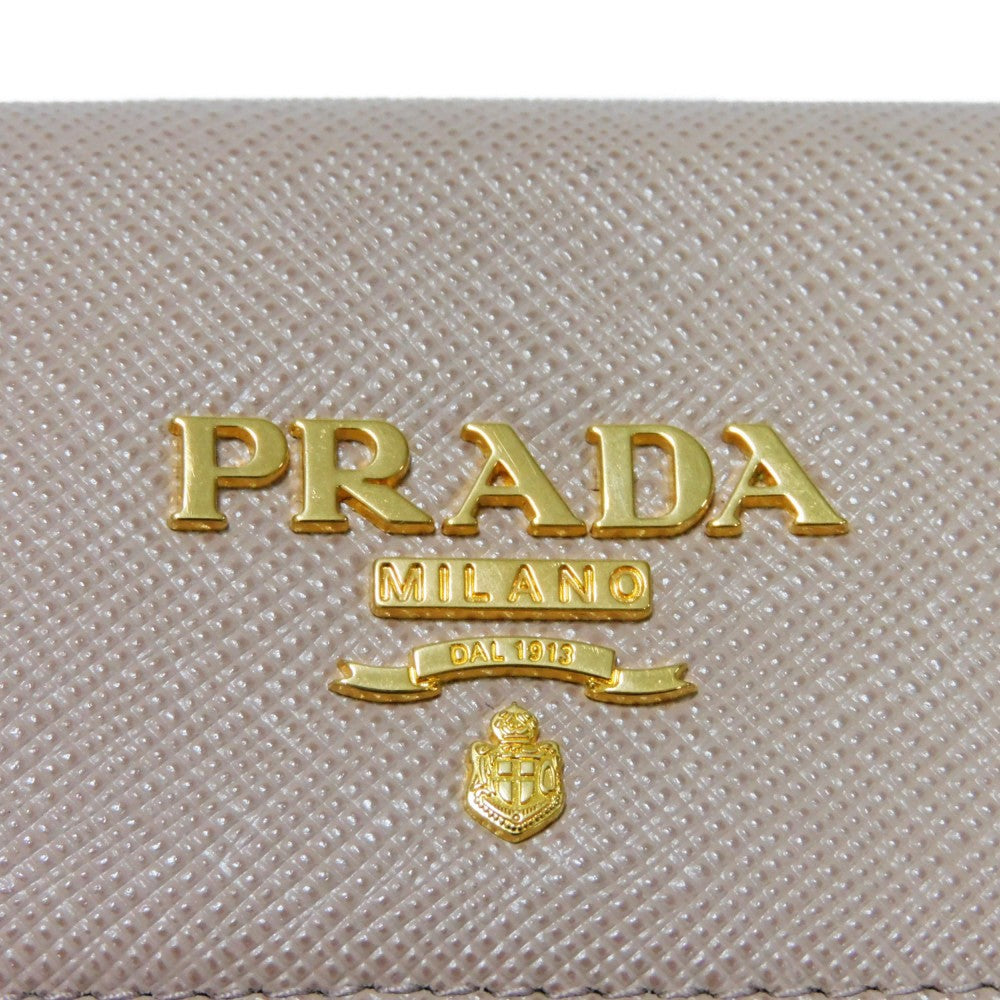 PRADA Key case Key holder  1PG004 ZLP F0KNX Safiano leather (stamped) Cipria x Fuoco logo metal Saffiano 4-ring keychain