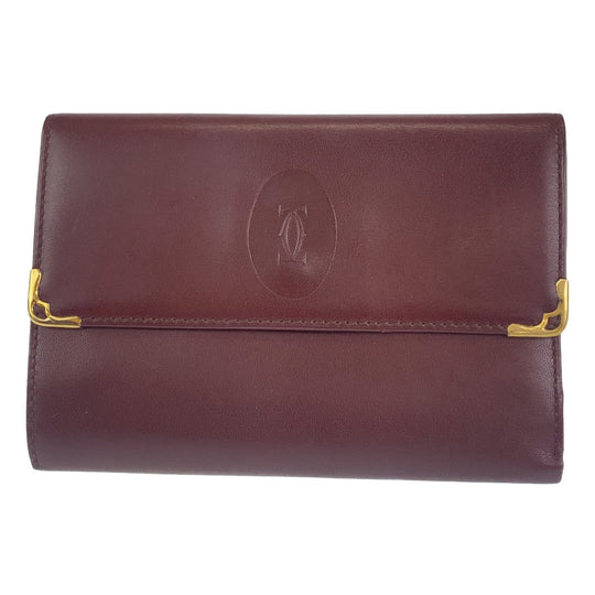 CARTIER Tri-fold wallet leather wine-red Must Line