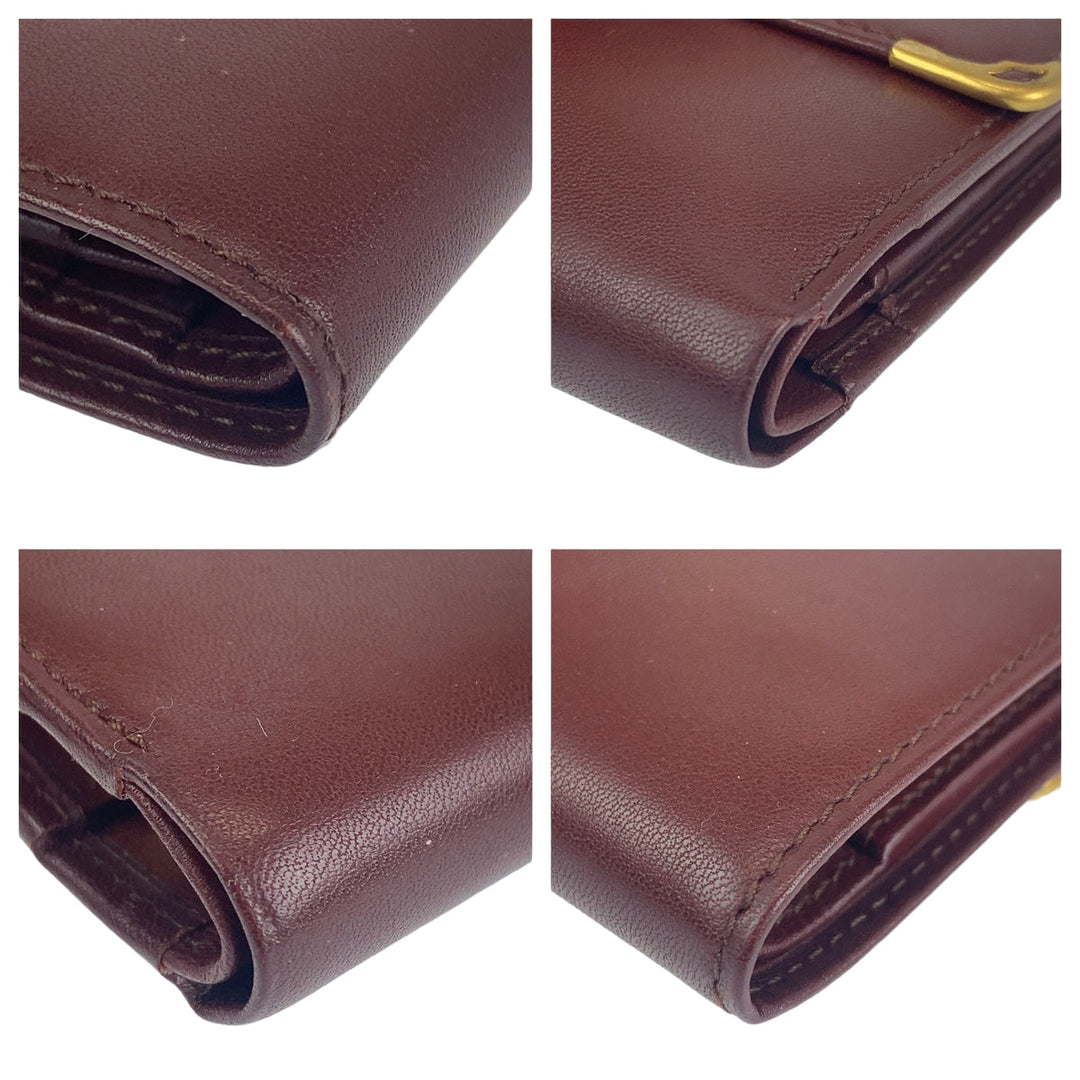 CARTIER Tri-fold wallet leather wine-red Must Line