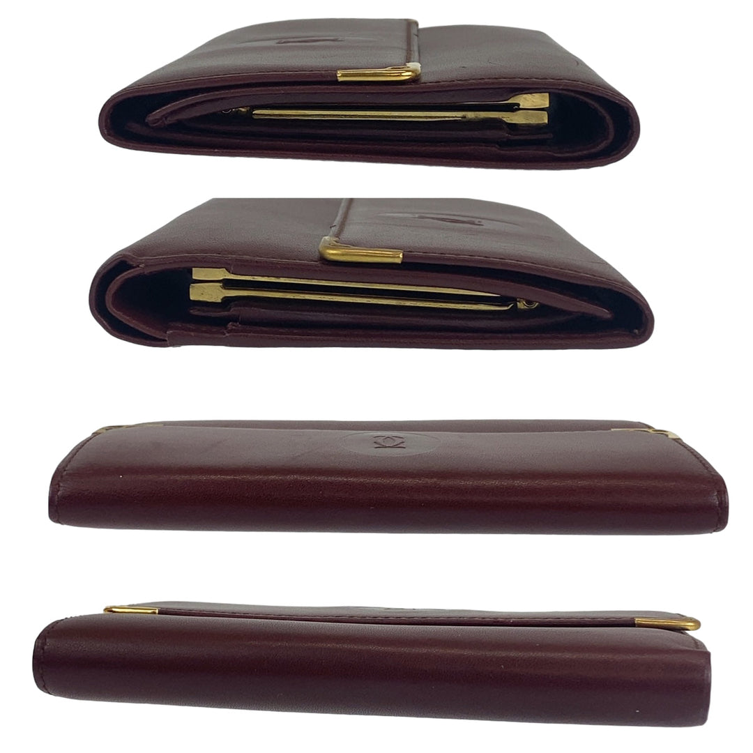 CARTIER Tri-fold wallet leather wine-red Must Line