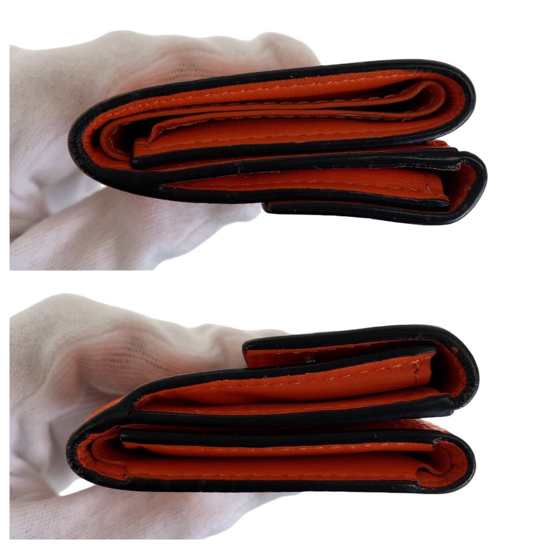 LOUIS VUITTON Tri-fold wallet M69245 leather Volcano orange Folding wallet Compact wallet Taiga Lama Monogram Discovery compact wallet Women Used Authentic