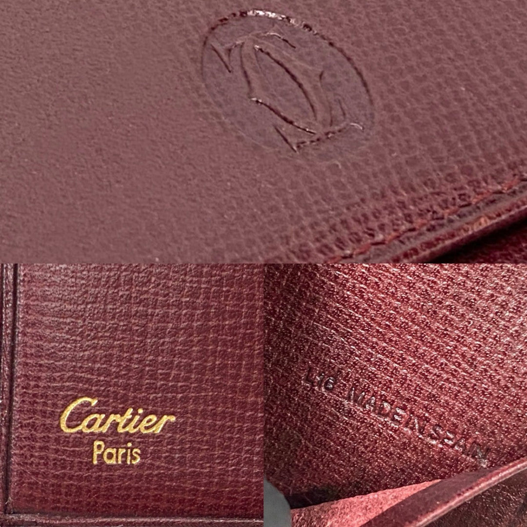 CARTIER Tri-fold wallet leather wine-red Must Line