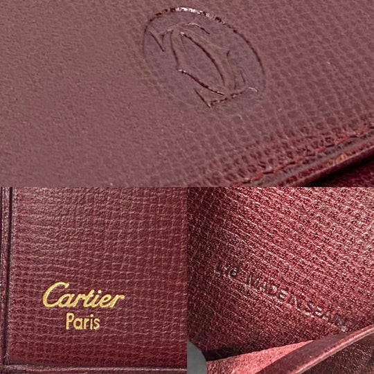 CARTIER Tri-fold wallet leather wine-red Must Line