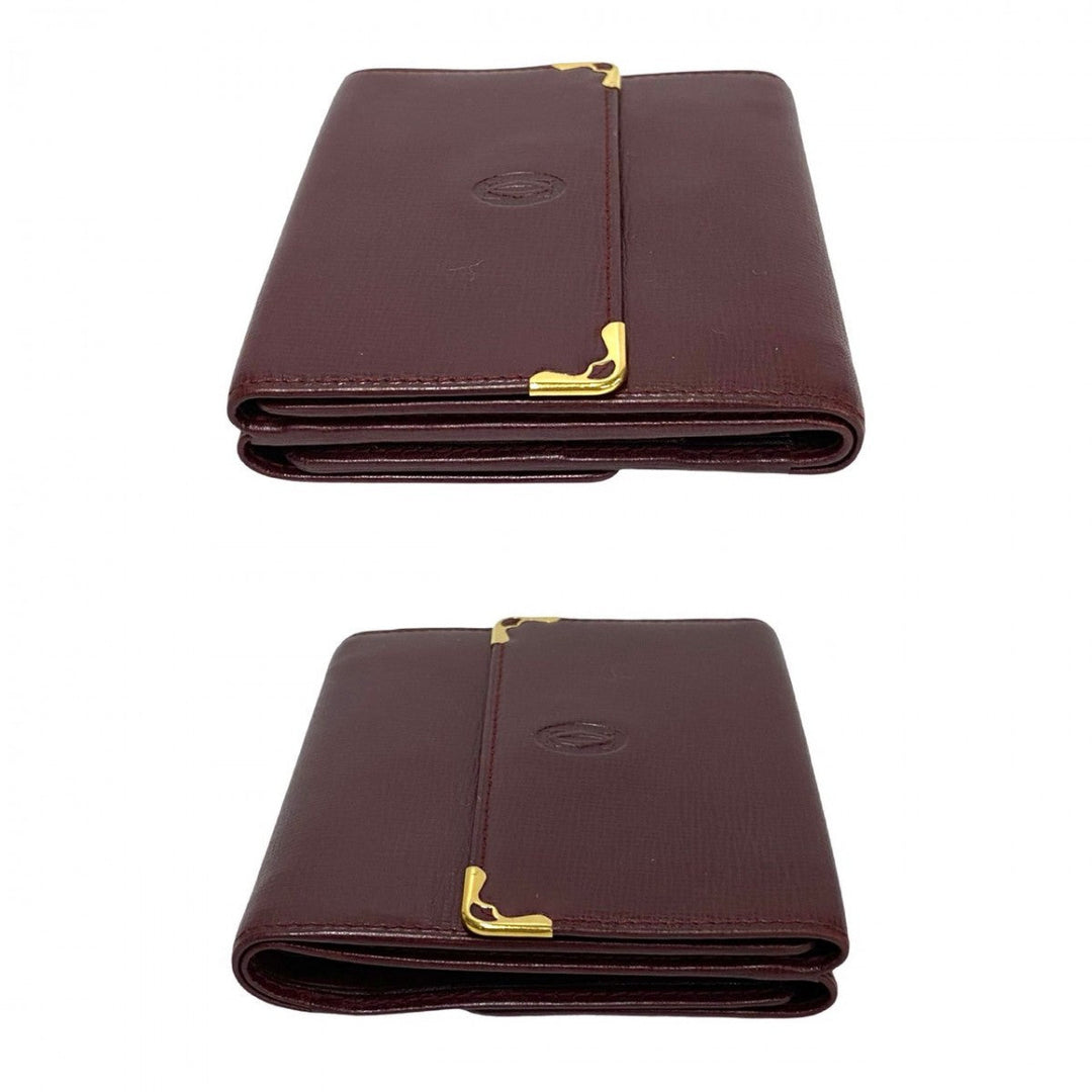 CARTIER Tri-fold wallet leather wine-red Must Line