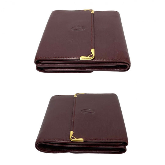 CARTIER Tri-fold wallet leather wine-red Must Line