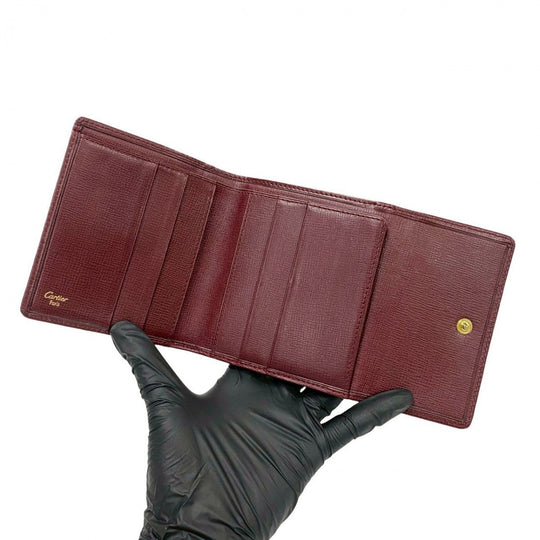 CARTIER Tri-fold wallet leather wine-red Must Line