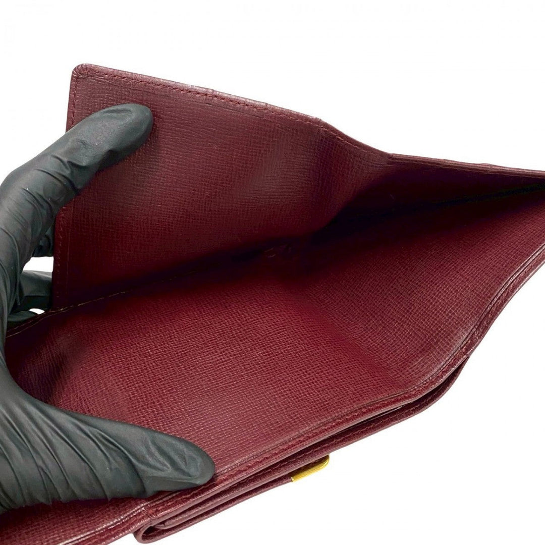 CARTIER Tri-fold wallet leather wine-red Must Line