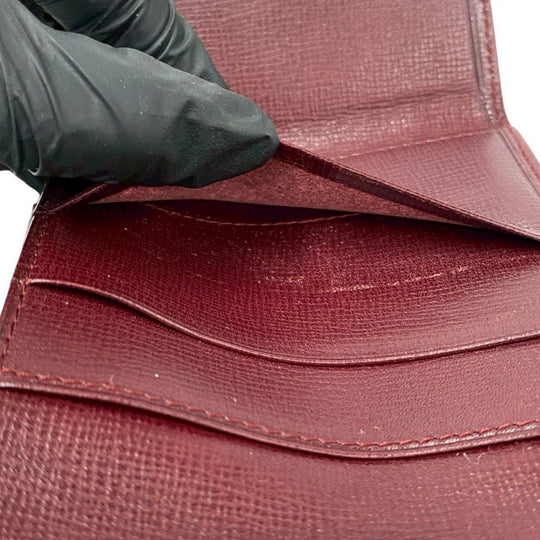 CARTIER Tri-fold wallet leather wine-red Must Line