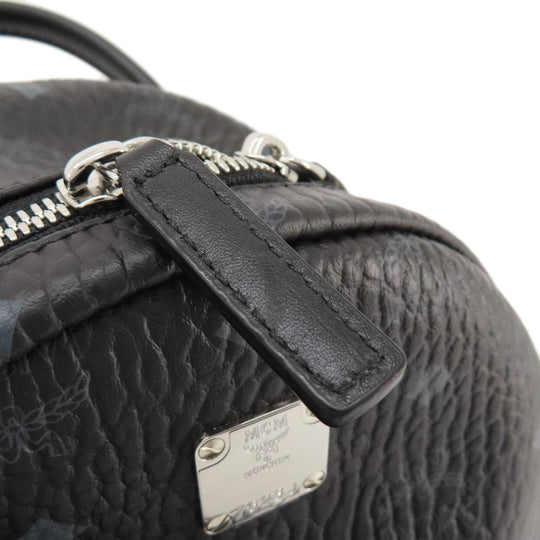 MCM Backpack PVC black logo Women Used Authentic