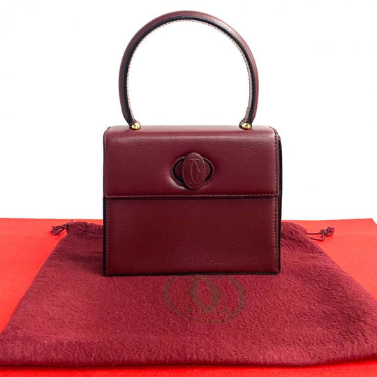 CARTIER Handbag leather wine-red Must Line