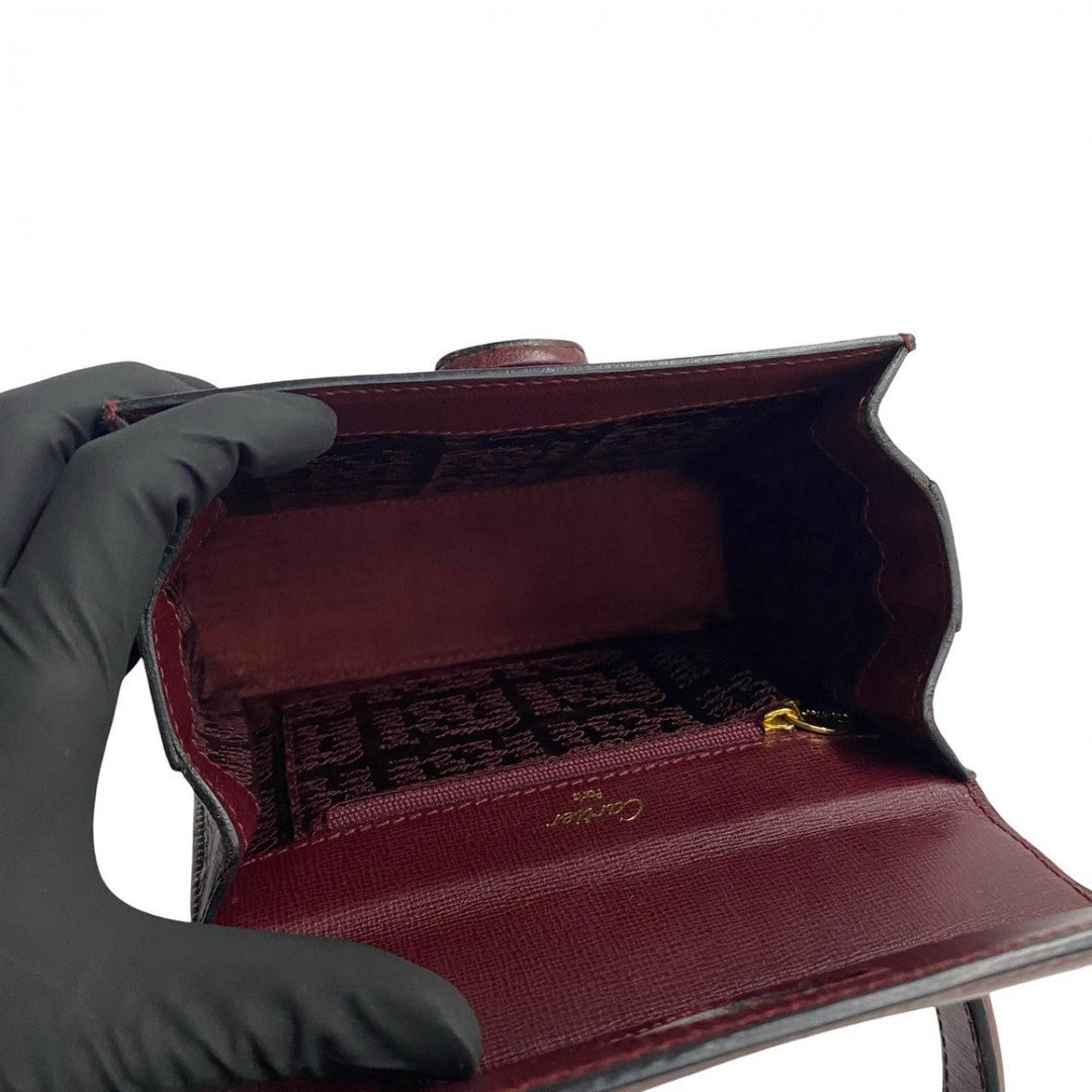 CARTIER Handbag leather wine-red Must Line