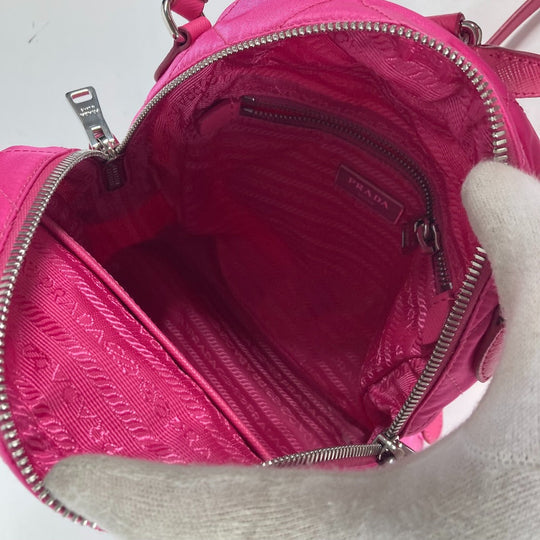 PRADA Backpack 1BZ066 Nylon, Saffiano Leather pink Triangle logo plate Quilted backpack Women Used Authentic