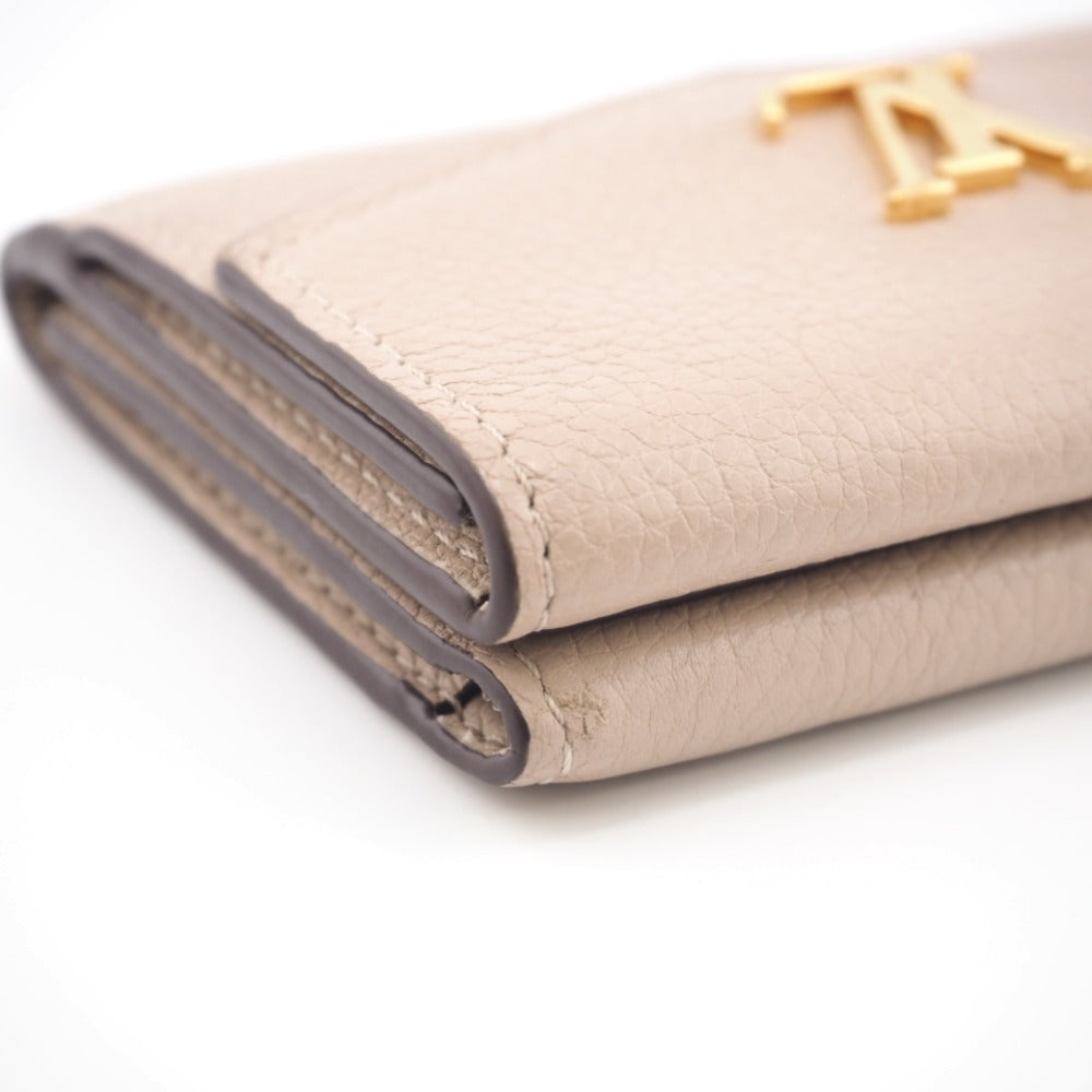 LOUIS VUITTON Tri-fold wallet M69340 Taurillon Clemence beige Taurillon Clemence Portefeuille Lock Mini Women Used Authentic